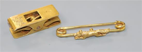 An early 20th century 18ct gold novelty double peg clip and a yellow metal fox brooch, brooch 37mm.